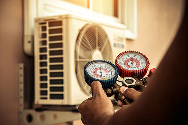 Professional Air Conditioning Service technician working in Gratis, OH